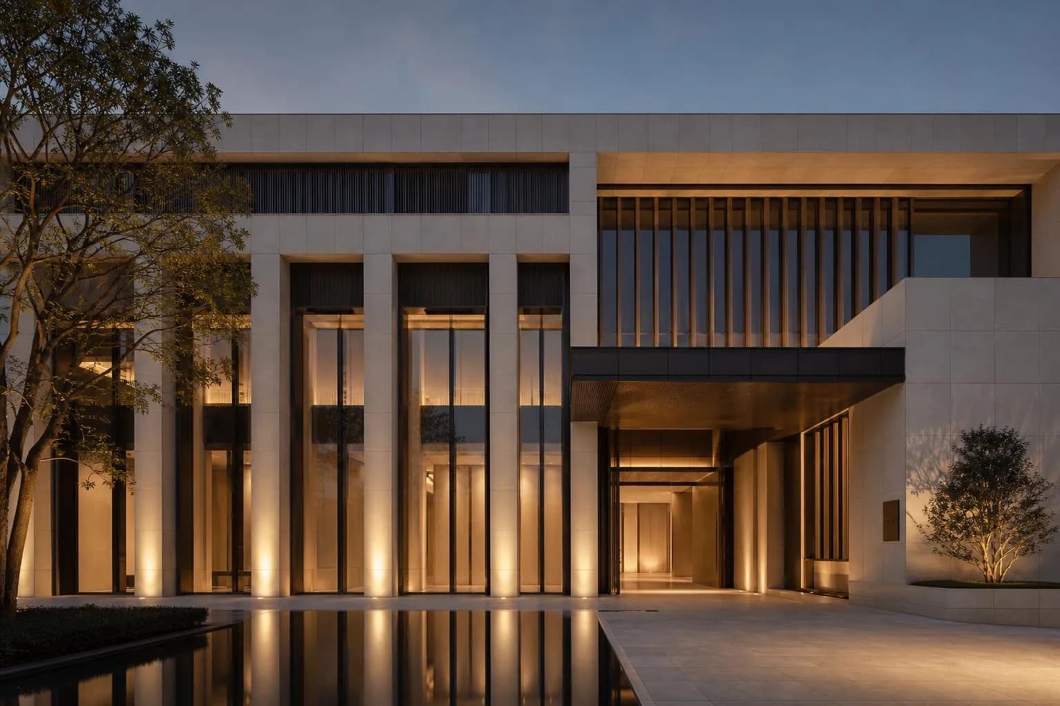 Modernist stone and glass facade with geometric planes and clean lines, lit by soft directional light