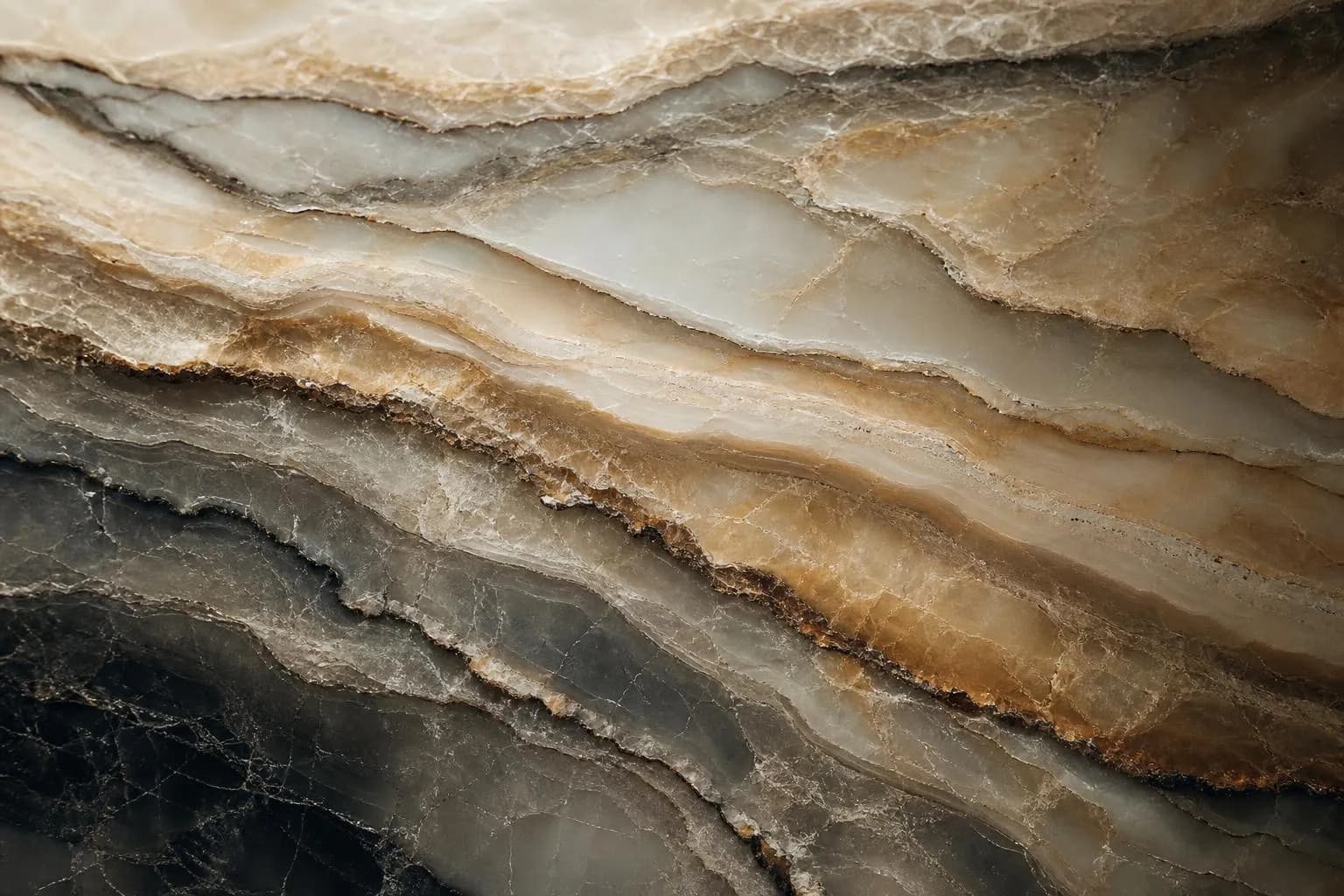 Close-up of layered marble veining in cool tones, with raking light emphasizing texture and depth.