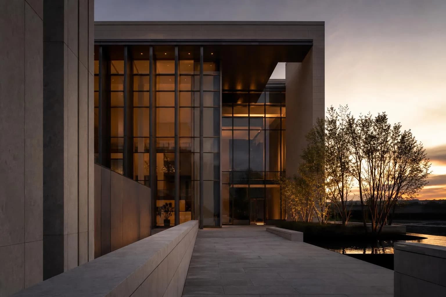 Modernist building facade with clean geometric lines and precise architectural detailing at dusk.