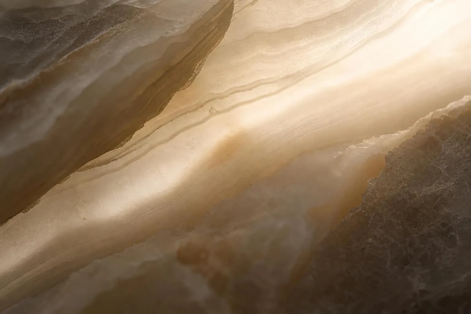 Close-up of translucent marble with subtle veining and soft backlighting.