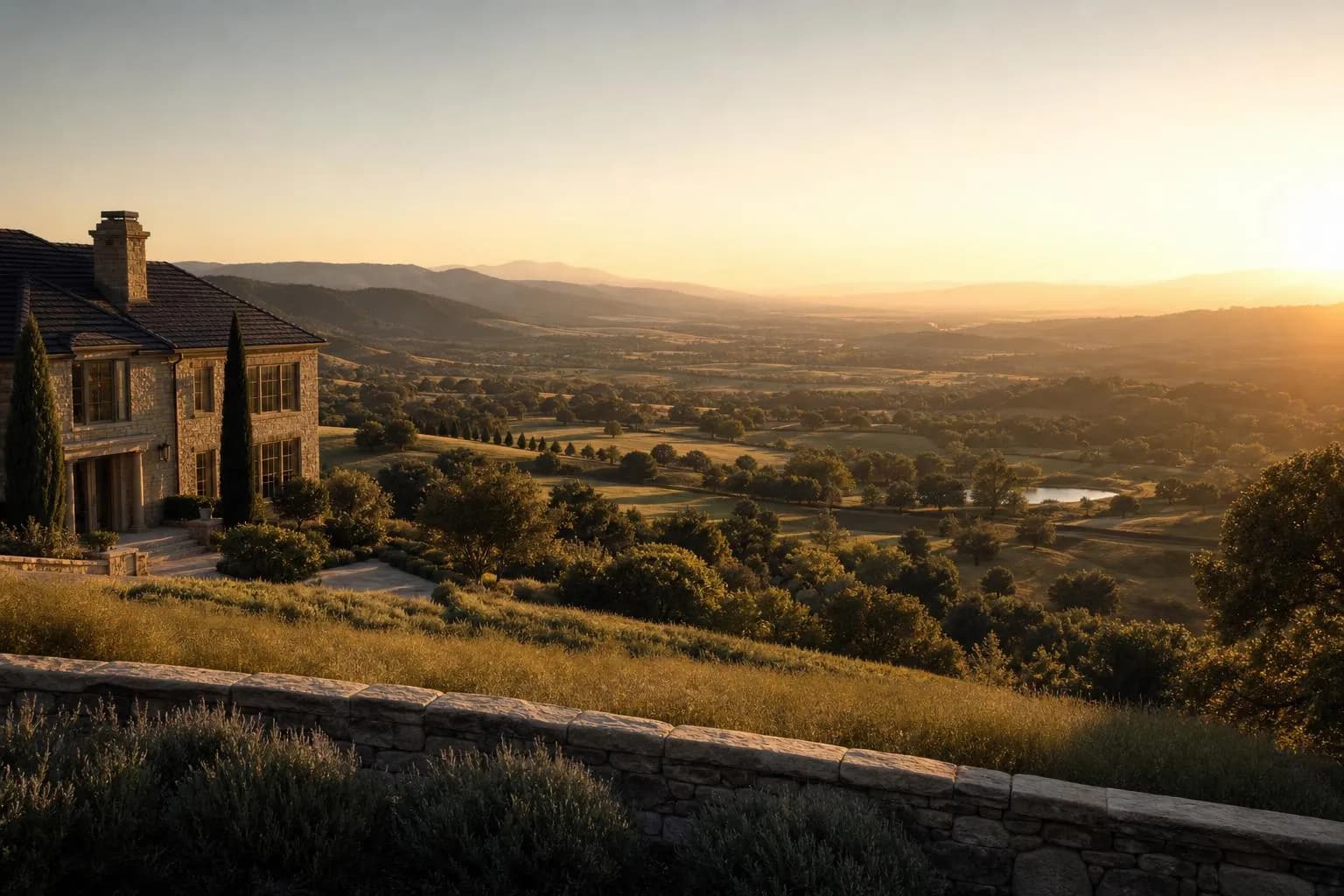 Golden-hour landscape with rolling estate grounds divided by a subtle threshold, distant hills glowing in warm light