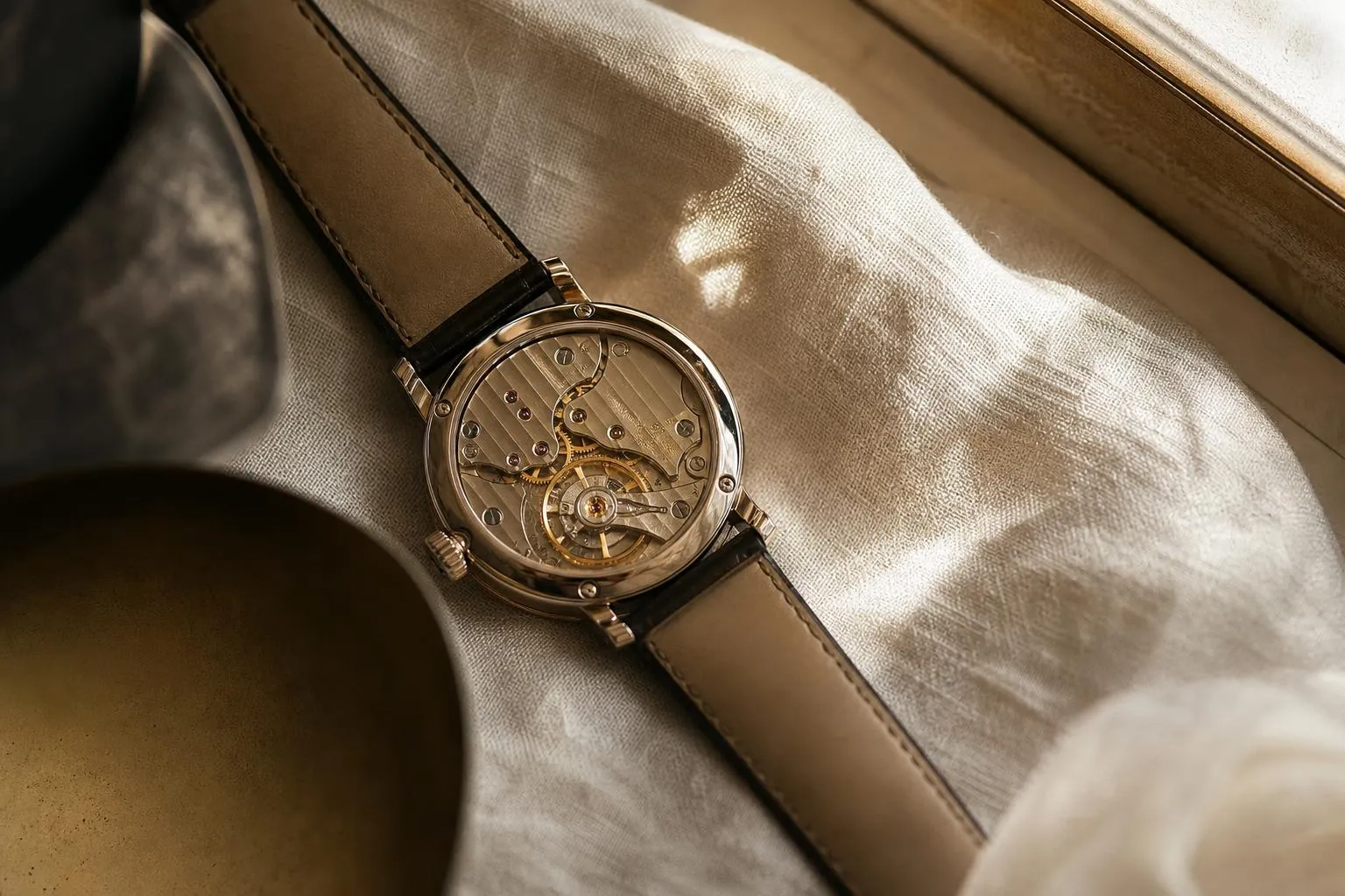 Luxury mechanical watch on cream linen, soft natural light, detailed craftsmanship.