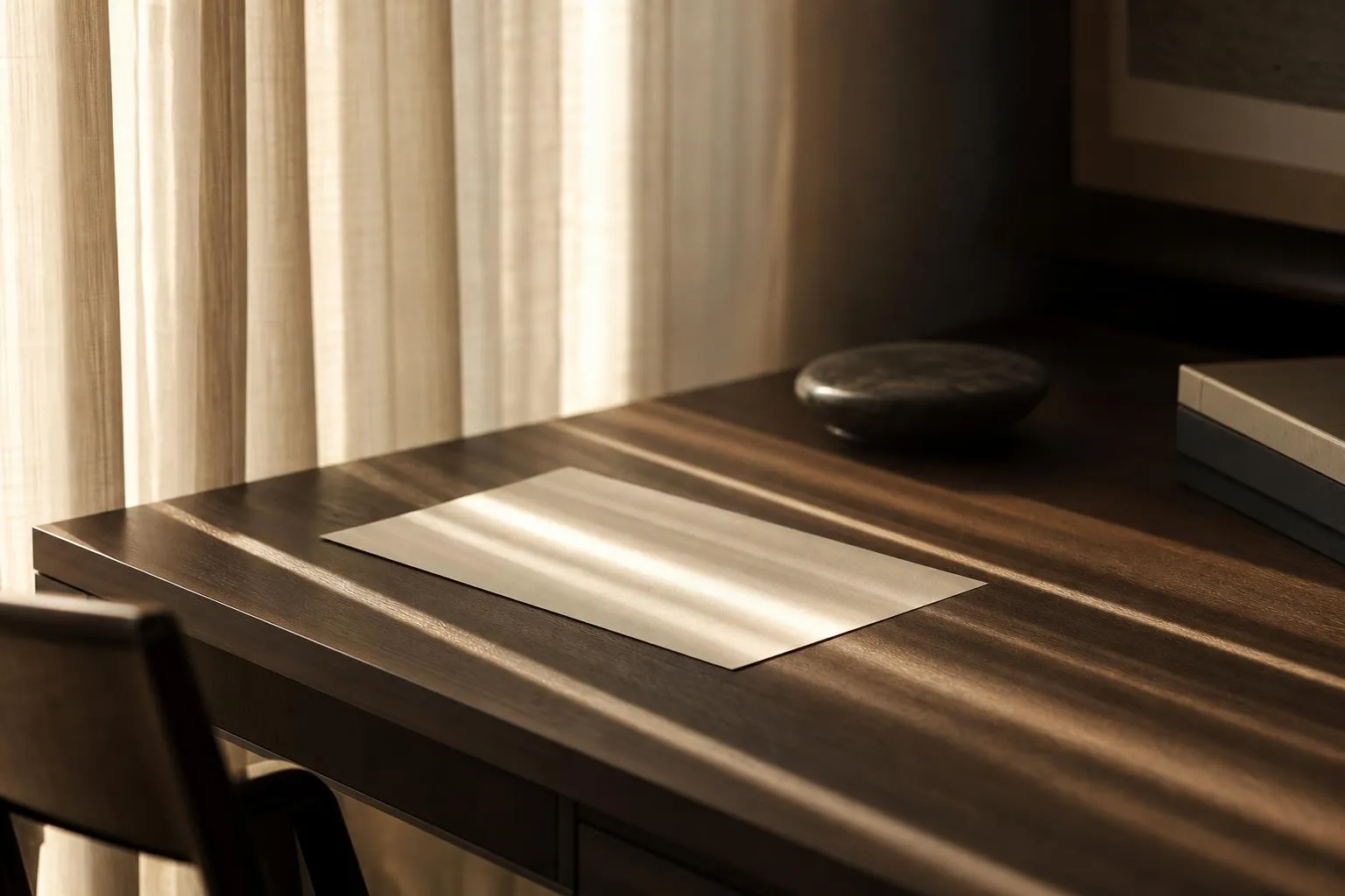 Soft morning light through sheer curtains casts delicate shadows on a minimal surface
